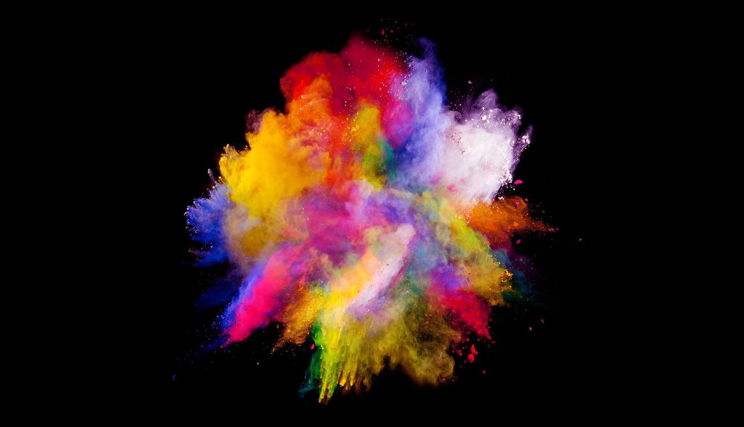 Explosão de poeira colorida em fundo preto